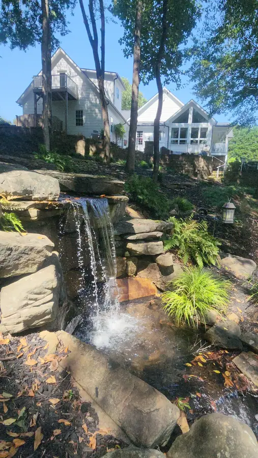 A stepped cascade over stacked stone dropping into a lower basin. Right in your own backyard, this kind of feature brings the peace and tranquility of the Upstate SC beauty we all love.