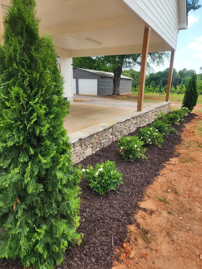A simple stone wall addition that turned this 1940s farmhouse restoration into a traffic-stopper in the Greer countryside, right between Greenville and Spartanburg.