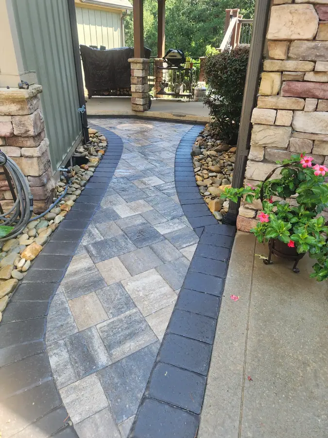 A long approach walk laid in a diamond field with river-rock borders. This once-unusable walk at an Inman home is now a convenient side entry that makes carrying groceries into the kitchen easy.